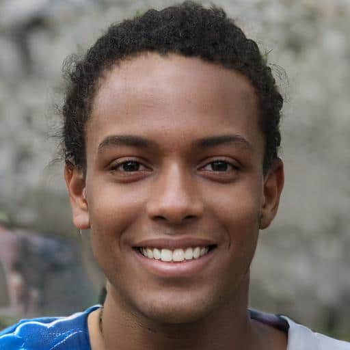 Smiling person with curly hair outdoors