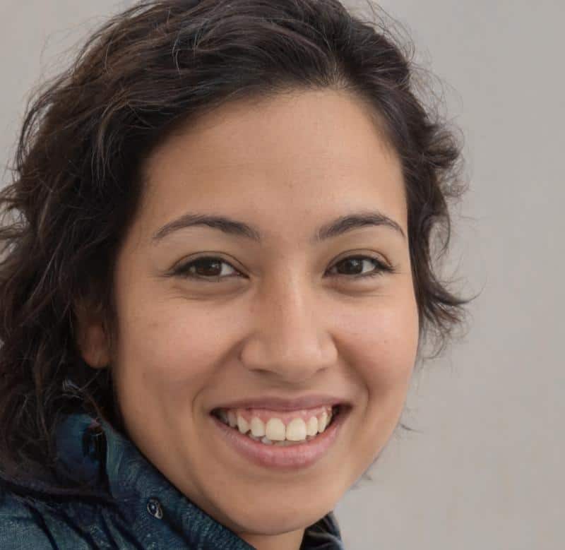Smiling woman with short, dark hair.